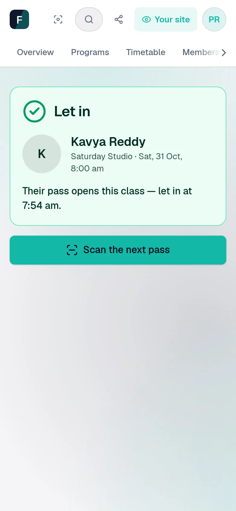 A member's pass scanned at the studio door: a green Let in, with her name and photo, the class, and Scan the next pass.