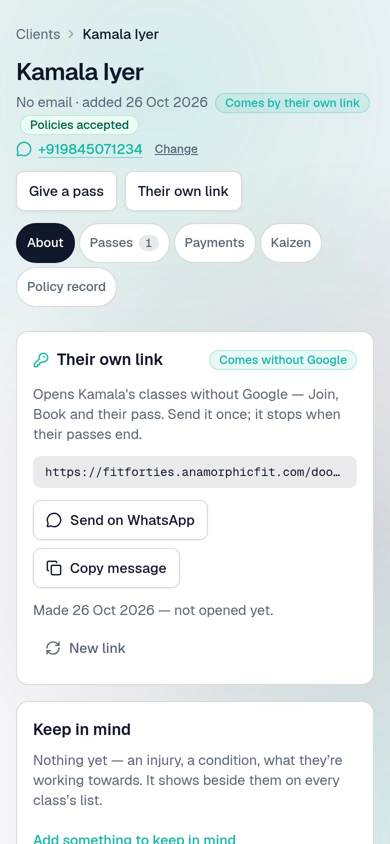 A member added without Google, on the owner's phone: her name marked Comes by their own link, and Their own link — what it opens, Send on WhatsApp with the words written, whether she has opened it, and New link.